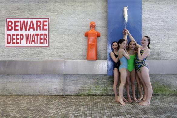 Members of Crystal Palace diving club shower during a training session in London March 9, 2012.