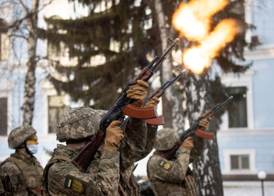 Service members attend a ceremony in tribute to fallen defenders of Ukraine in Kyiv (via REUTERS)