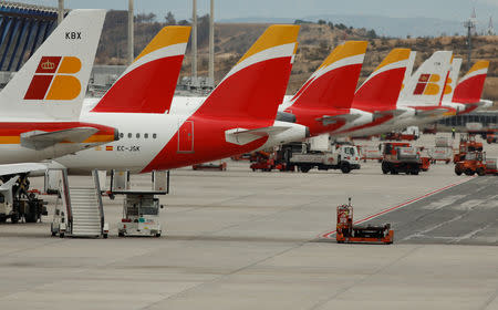 FILE PHOTO: Passenger aircraft of Spanish airline Iberia at the Adolfo Suarez Barajas airport in Madrid, Spain, March 9, 2016. REUTERS/Sergio Perez
