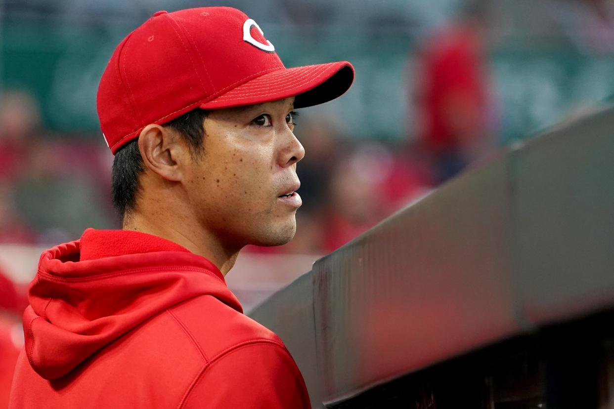 Cincinnati Reds outfielder Shogo Akiyama (4) watches the game from the dugout in the second inning of a baseball game against the Washington Nationals, Thursday, Sept. 23, 2021, at Great American Ball Park in Cincinnati. 