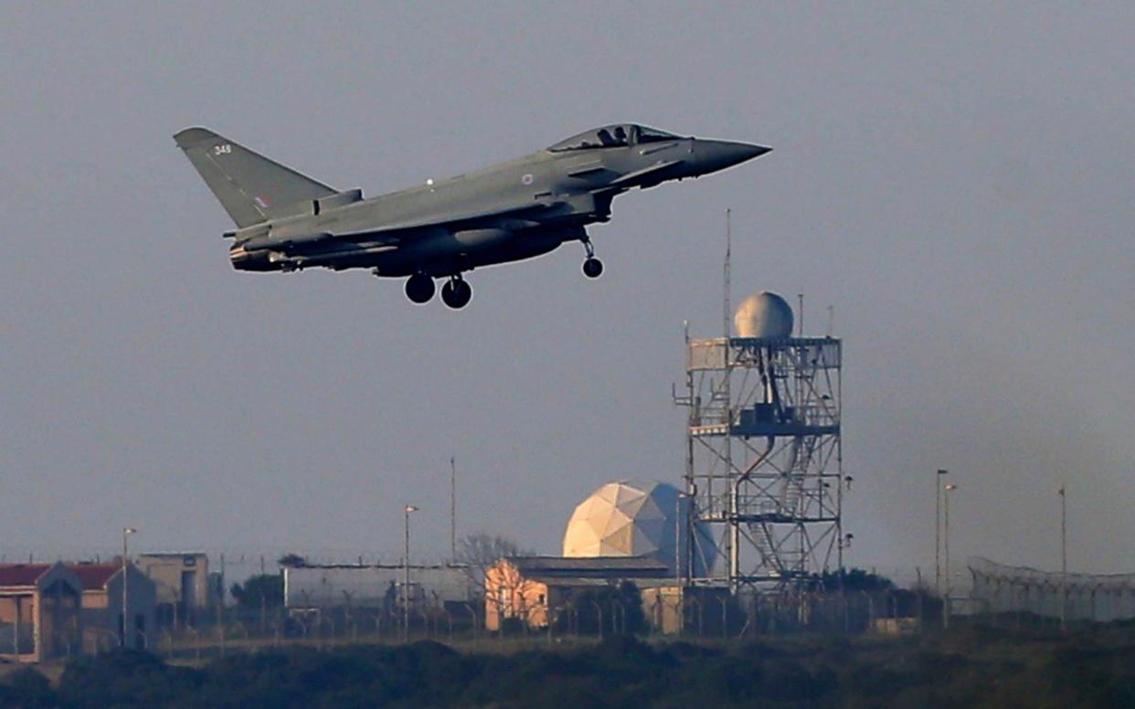 A Typhoon aircraft prepares for landing at the British Royal Air Force base in Akrotiri, near costal city of Limassol in the eastern Mediterranean island of Cyprus, early Saturday - AP