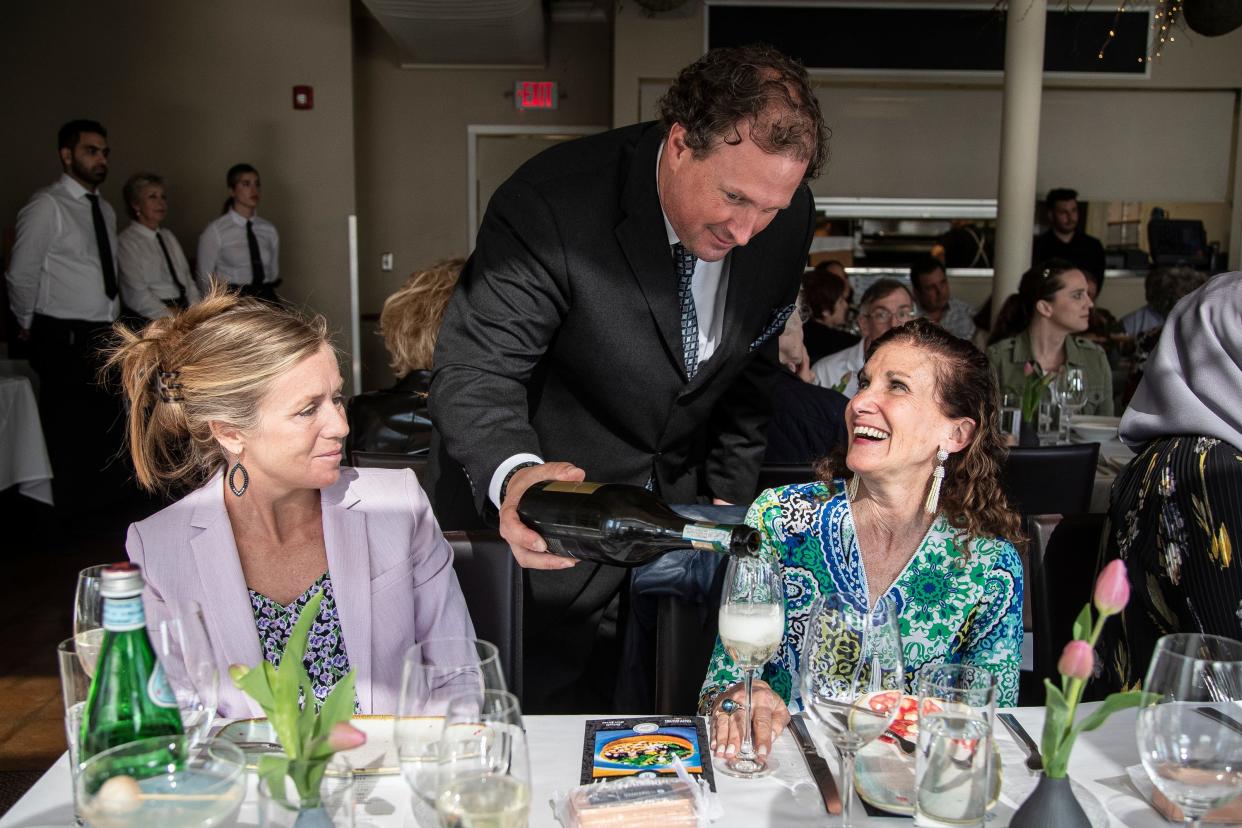 Sommelier Brian Macmillan pours a drink for Renee Turissini, of Ann Arbor, during the Detroit Free Press/Metro Detroit Chevy Dealers Top 10 Takeover of Tallulah Wine Bar & Bistro in Birmingham on Tuesday, May 9, 2023.