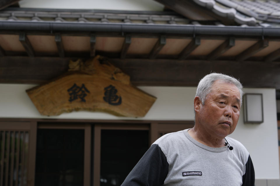 Yukinaga Suzuki, an inn keeper, listens to a question during an interview with The Associated Press at his inn in Iwaki, northeastern Japan, Thursday, July 6, 2023. Residents worry that the water discharge after 12 years of recovery effort since the nuclear disaster could deal another setback to Fukushima's image and hurt their businesses and livelihoods. (AP Photo/Hiro Komae)