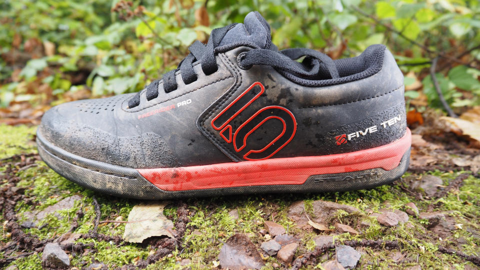 Side view of a Five Ten MTB shoe on the ground