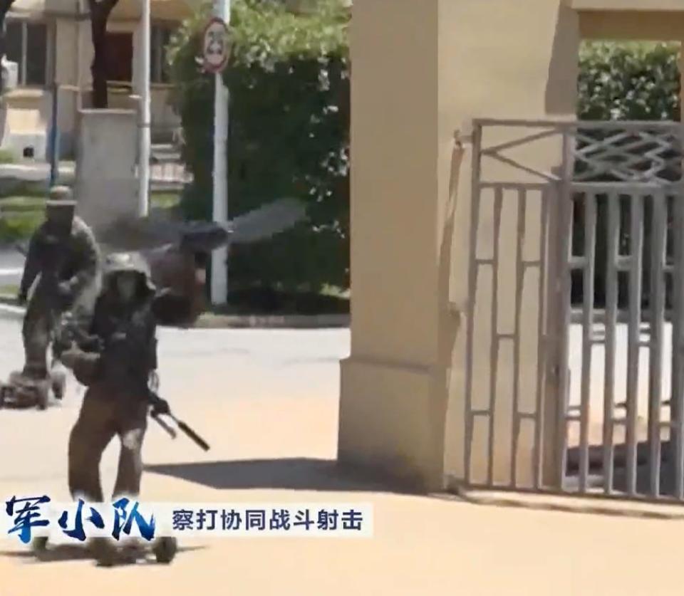 A Chinese commando on an electric skateboard threw a drone designed to look like an eagle at a televised combat exercise.