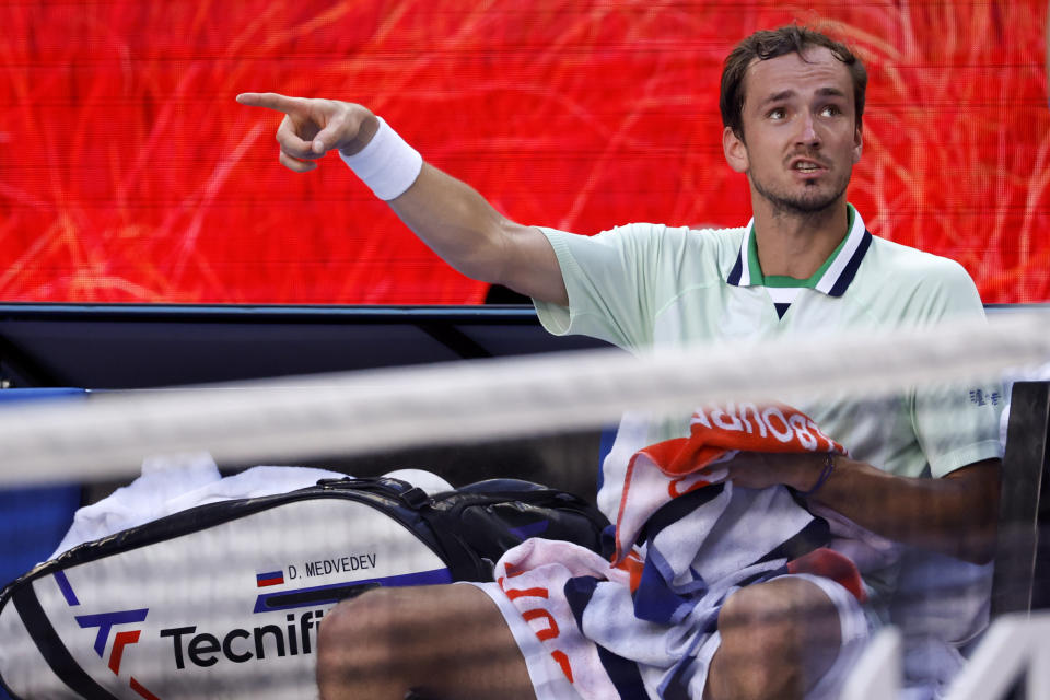 Daniil Medvedev of Russia reacts as he talks with the chair umpire during his fourth round match against Maxime Cressy of the U.S. at the Australian Open tennis championships in Melbourne, Australia, Monday, Jan. 24, 2022. (AP Photo/Hamish Blair)