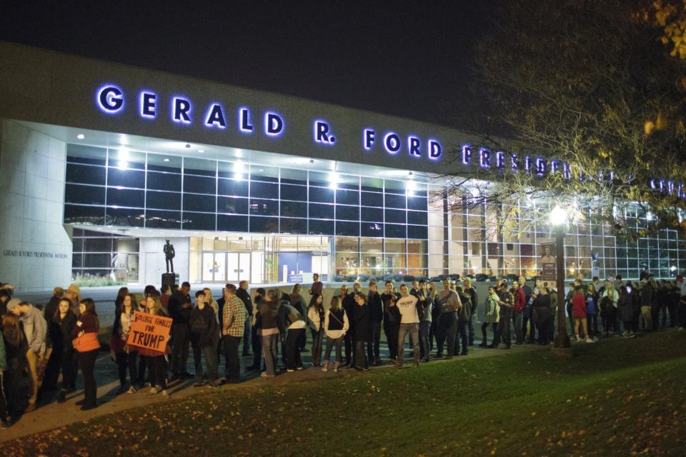 Supporters of Republican presidential candidate Donald Trump wait in line outside of DeVos Place where Trump is scheduled to speak in the Grand Gallery of DeVos Place in Grand Rapids, Mich., Monday, Nov. 7, 2016. (Photo: Joel Bissell/The Grand Rapids Press via AP)