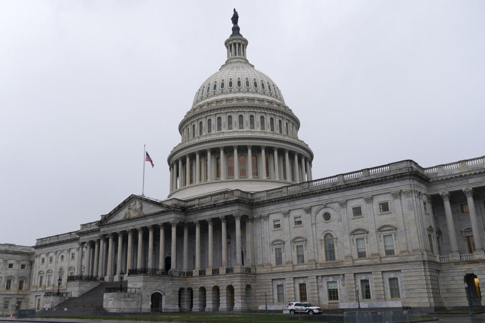 FILE- This Dec. 24, 2020, file photo shows the U.S. Capitol is seen in Washington. Unemployment insurance aid is expiring for millions on the weekend as President Donald Trump holds a pandemic relief package in limbo and gripes about “pork” in the bipartisan legislation passed by Congress. (AP Photo/Jacquelyn Martin, File)