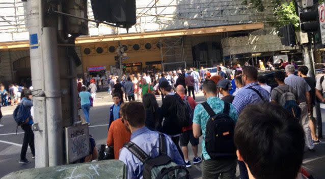 Dozens of bystanders watched on as a number of pedestrians lay on the road. Source: Twitter/ Mike Lee