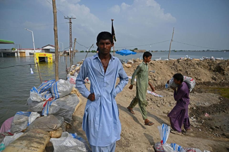 <div class="inline-image__title">1243016443</div> <div class="inline-image__caption"><p>Local residents place sand bags to prepare a wall to protect population from flood waters in Mehar area after heavy monsoon rains in Dadu district, Sindh province on September 7, 2022. Record monsoon rains have caused devastating floods across Pakistan since June, killing more than 1,200 people and leaving almost a third of the country under water, affecting the lives of 33 million.</p></div> <div class="inline-image__credit">Photo by Aamir Qureshi/AFP via Getty Images</div>