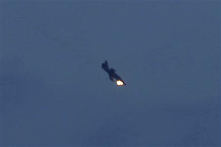 A Syrian Air Force fighter plane fires a rocket over the 80th Brigade's base near Aleppo International Airport, November 8, 2013. REUTERS/Molhem Barakat