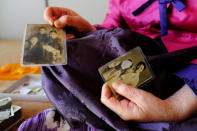 Lee Yong-soo, 90, one of less than 30 known surviving South Korean victims of JapanÕs wartime brothels, displays a photograph in Daegu, South Korea October 30, 2018, of her taken shortly after she returned to Korea in 1945 after being held at an airbase for kamikaze pilots in Taiwan. Picture taken October 30, 2018. REUTERS/Josh Smith