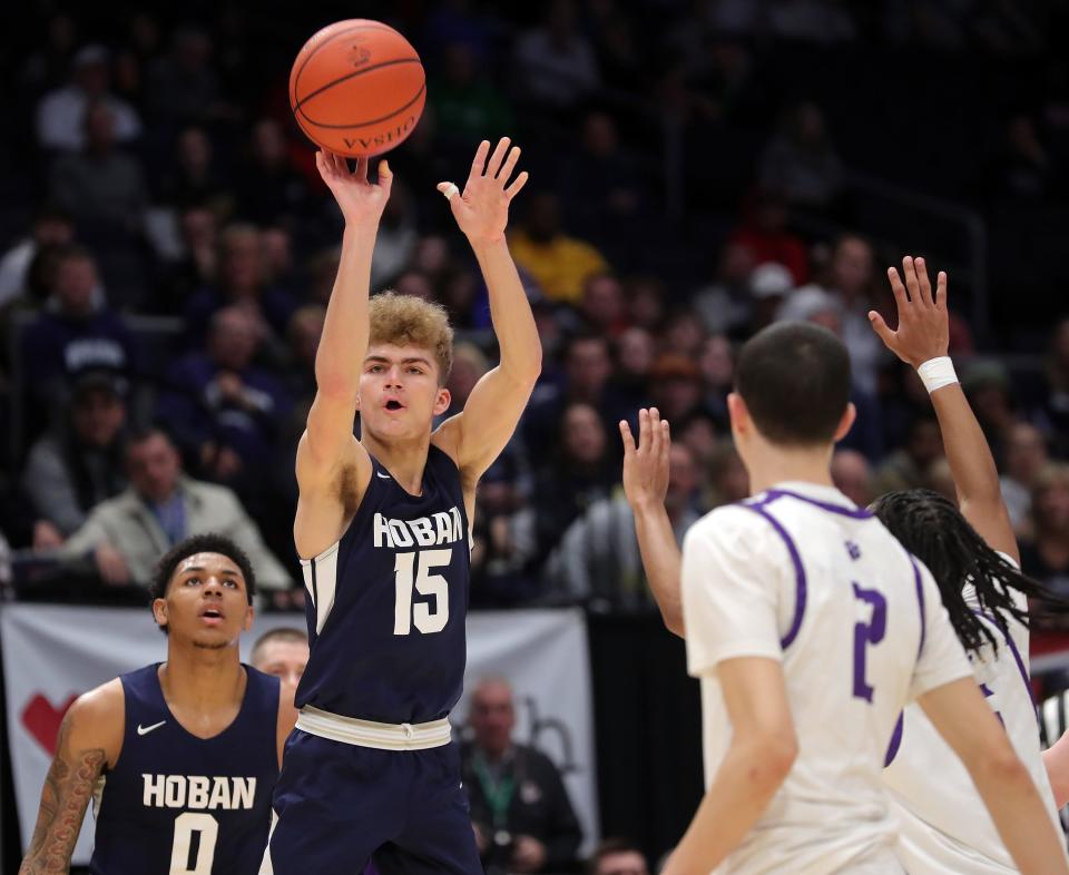 Hoban guard Logan Vowles shoots a first-half 3-pointer in the OHSAA Division I state final against Pickerington Central, Sunday, March 19, 2023, in Dayton.