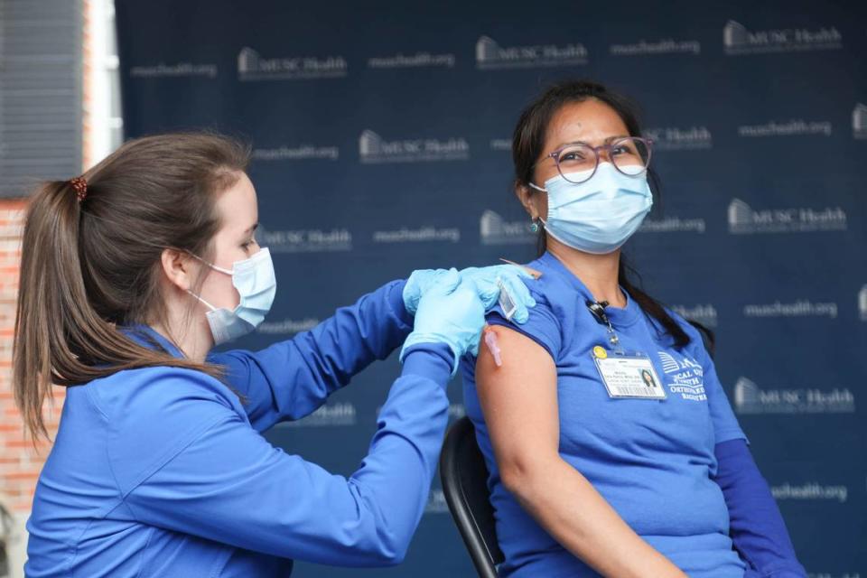 Registered nurse Erika Hutzler administers the Covid-19 vaccine to Metzfe Dela Rama at The Medical University of South Carolina in Charleston, S.C. on Tuesday, Dec. 15, 2020.