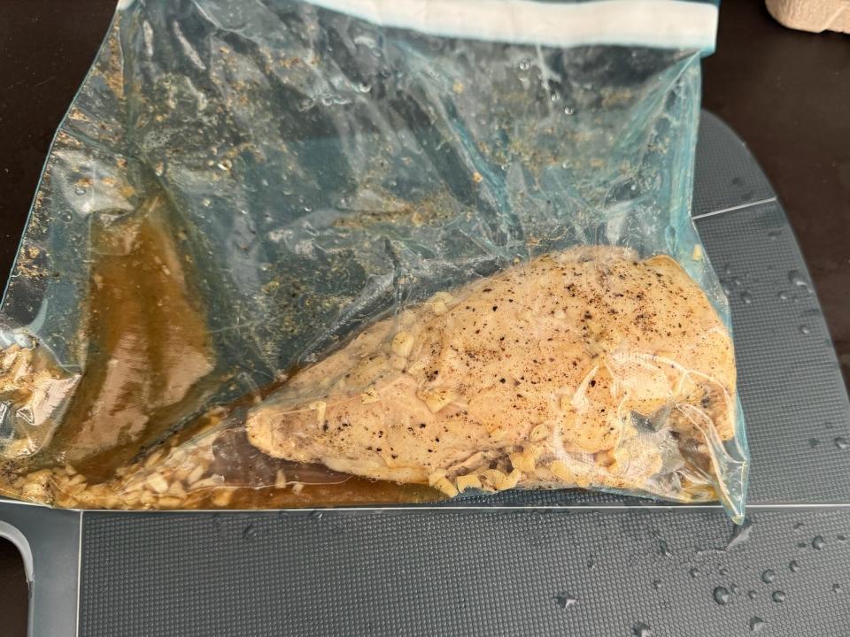 marinated chicken breast in a plastic bag