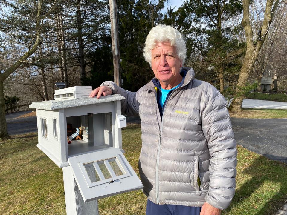 Don Powell, an Orchard Lake resident and Farmington Hills business owner, shows off his custom mailbox, where a mystery "family" showed up last August.