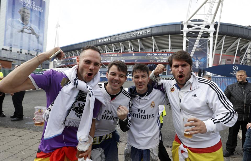 <p>Real Madrid fans pose for a photo outside the stadium prior to the Champions League soccer final at the National Stadium, Cardiff </p>