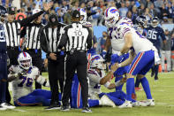 Buffalo Bills quarterback Josh Allen (17) is helped up after his run was ruled short of the distance needed for a first down on the Bills' final play of the game against the Tennessee Titans in an NFL football game Monday, Oct. 18, 2021, in Nashville, Tenn. The Titans won 34-31. (AP Photo/Mark Zaleski)