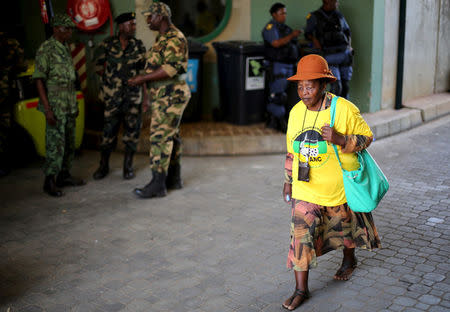 FILE PHOTO: A supporter of the African National Congress (ANC) arrives for the party's 104th anniversary celebrations in Rustenburg, South Africa January 9, 2016. REUTERS/Siphiwe Sibeko/File Photo