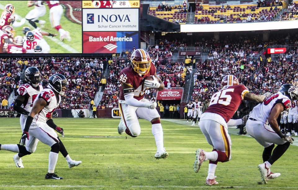 <p>Washington Redskins running back Kapri Bibbs (46) goes over for the second Redskins touchdown in the third quarter during a NFL game between the Washington Redskins and the Atlanta Falcons on November 04, 2018, at Fedex Field, in Landover, Maryland.(Photo by Tony Quinn/Icon Sportswire via Getty Images) </p>