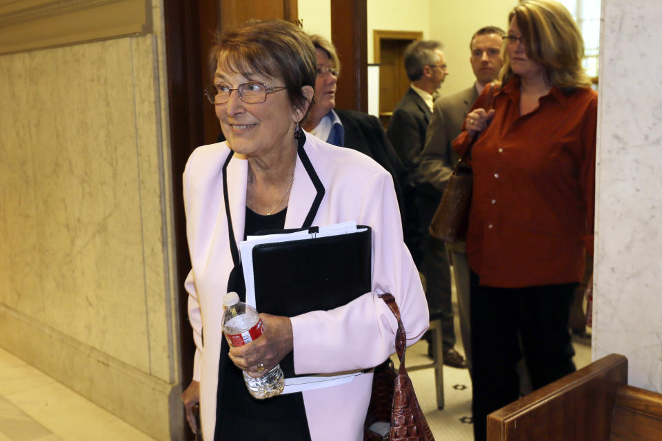 Attorney Cheryl Maples, left, leaves a courtroom in the Pulaski County Court House in Little Rock, Ark., Thursday, April 17, 2014. Maples argued for gay couples who are advocates of ending Arkansas' ban on same-sex marriage. Circuit Judge Chris Piazza said at the conclusion of the hearing that he will issue a ruling in about two weeks. (AP Photo/Danny Johnston)