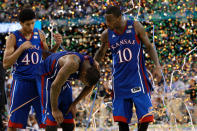 Kevin Young #40, Thomas Robinson #0 and Tyshawn Taylor #10 of the Kansas Jayhawks react after losing to the Kentucky Wildcats 67-59 in the National Championship Game of the 2012 NCAA Division I Men's Basketball Tournament at the Mercedes-Benz Superdome on April 2, 2012 in New Orleans, Louisiana. (Photo by Ronald Martinez/Getty Images)