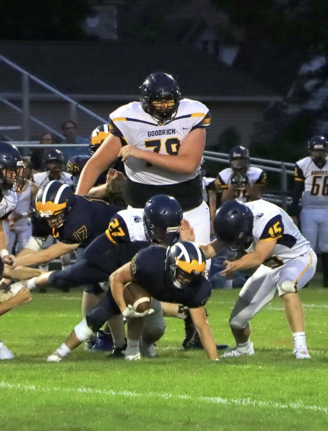 Eric Kilburn, 14, plays on the Goodrich High School junior-varsity football team. The defensive tackle sprained his ankle early in the season, likely due to a lack of cleats for his size 23 feet.