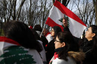 Lebanese protesters gather outside of the French foreign ministry in Paris, Wednesday, Dec. 11, 2019, to denounce a closed-door meeting of diplomats from several countries on aid to Lebanon. The Middle Eastern country is facing a political and economic crisis, and the international group is discussing conditions for global assistance to help ease Lebanon's financial woes.(AP Photo/Francois Mori)