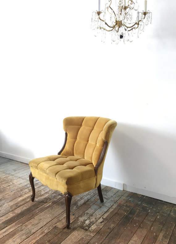 This super chic tufted velvet chair would work great as a side chair or even as a desk chair. Get it on <a href="https://www.etsy.com/listing/510244507/tufted-velvet-accent-chair-boho-chic?ga_order=most_relevant&amp;ga_search_type=all&amp;ga_view_type=gallery&amp;ga_search_query=accent%20chair&amp;ref=sr_gallery_8" target="_blank">Etsy</a>.