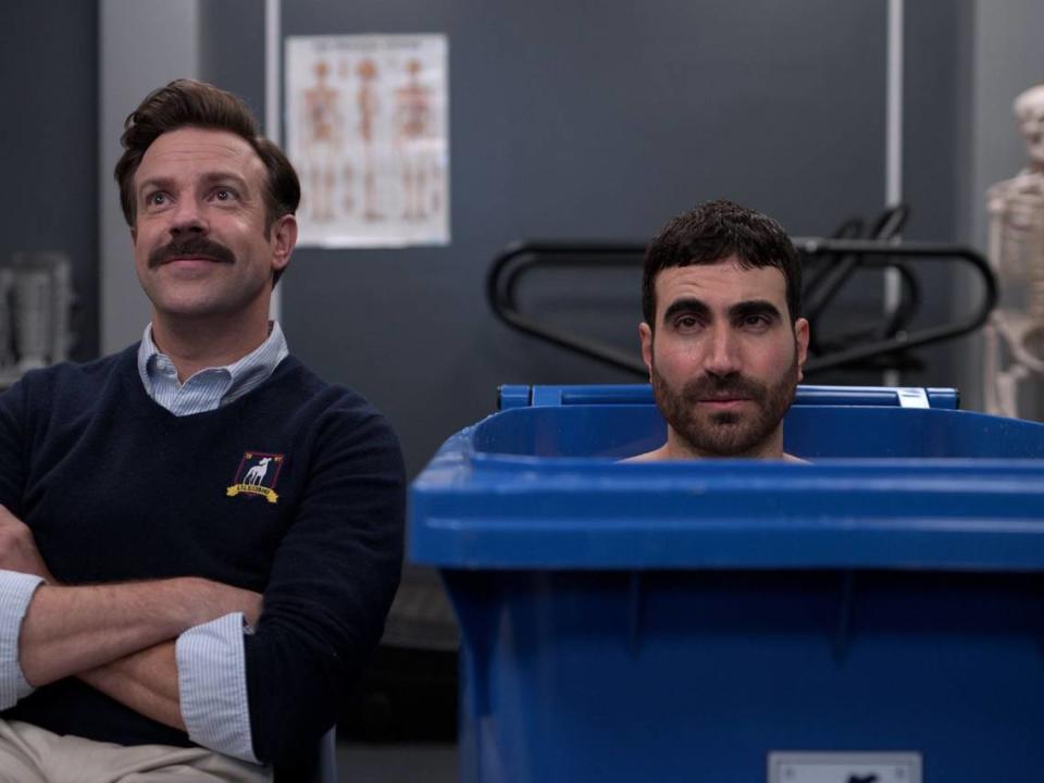 Emmy nominations went to Jason Sudeikis, left, who created and stars as Ted Lasso, and Brett Goldstein, a writer on the show who also plays Roy Kent, the mercurial team captain.