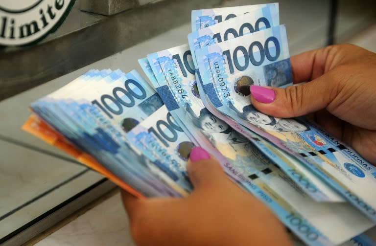 The Filipino peso hit a seven-year low to the dollar on Monday and foreign investors pulled out from local shares for a 23rd straight day