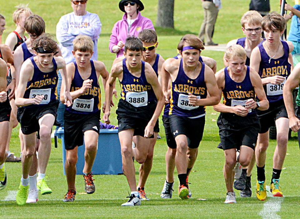 Watertown runners, from left, Bayley Steiner, Ayden Steiner (behind Bayley), Chris Bevers, Dane Stark, Tucker Lunde, Briley Martin, Isaiah Norton (behind Briley), Ty Sullivan, Ben Peterson and Gabe List take off at the start of the varsity boys' 5,000-meter race Thursday, Sept. 29, 2022 during the Watoma Invitational cross country meet at Cattail Crossing Golf Course.,