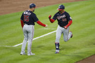 Washington Nationals' Juan Soto, right, celebrates his home run against Cincinnati Reds' Luis Castillo with third base coach Bob Henley during the sixth inning of a baseball game Thursday, Sept. 23, 2021, in Cincinnati. (AP Photo/Jay LaPrete)