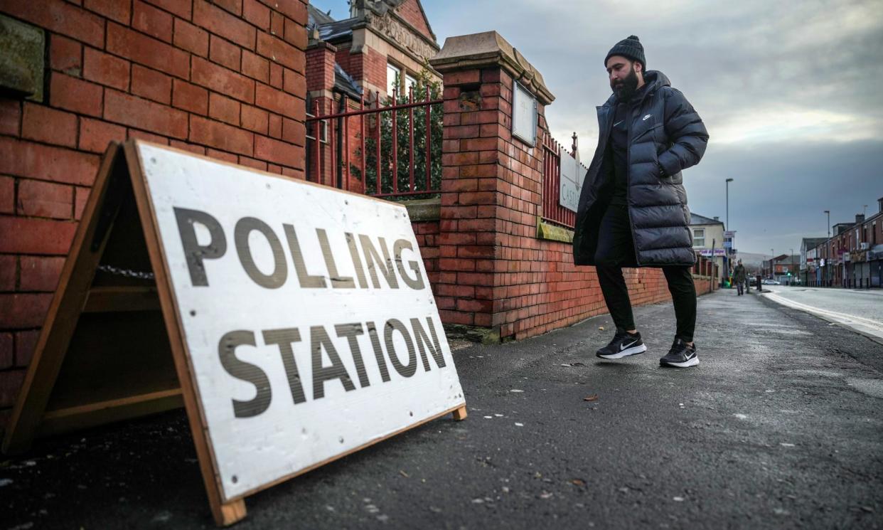<span>A man arrives at a polling station to vote in the Rochdale byelection on 29 February.</span><span>Photograph: Christopher Furlong/Getty Images</span>