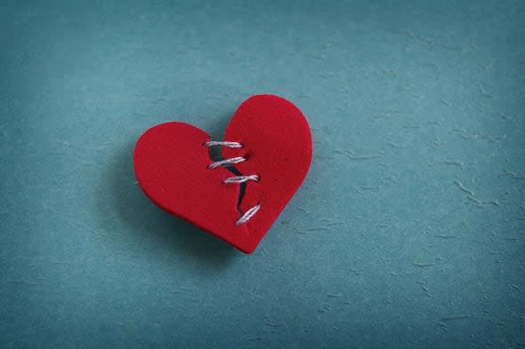 red heart  broken with threaded ...