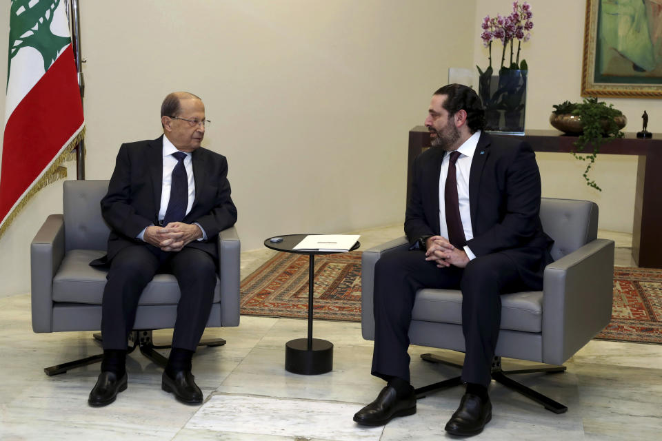 In this photo released by Lebanon's official government photographer Dalati Nohra, Lebanese President Michel Aoun, left meets with Lebanese newly-assigned Prime Minister, Saad Hariri, right, at the presidential palace, in Baabda, east of Beirut, Lebanon, Thursday, Jan. 31, 2019. Lebanese political factions have agreed on the formation of a new government, breaking a nine-month deadlock that only deepened the country' economic woes. (Dalati Nohra via AP)