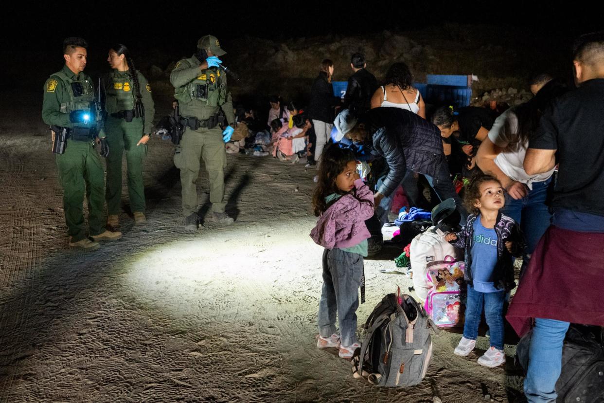 <span>People being processed by US border agents in San Diego, California, on 28 June 2024.</span><span>Photograph: Qian Weizhong/VCG via Getty Images</span>