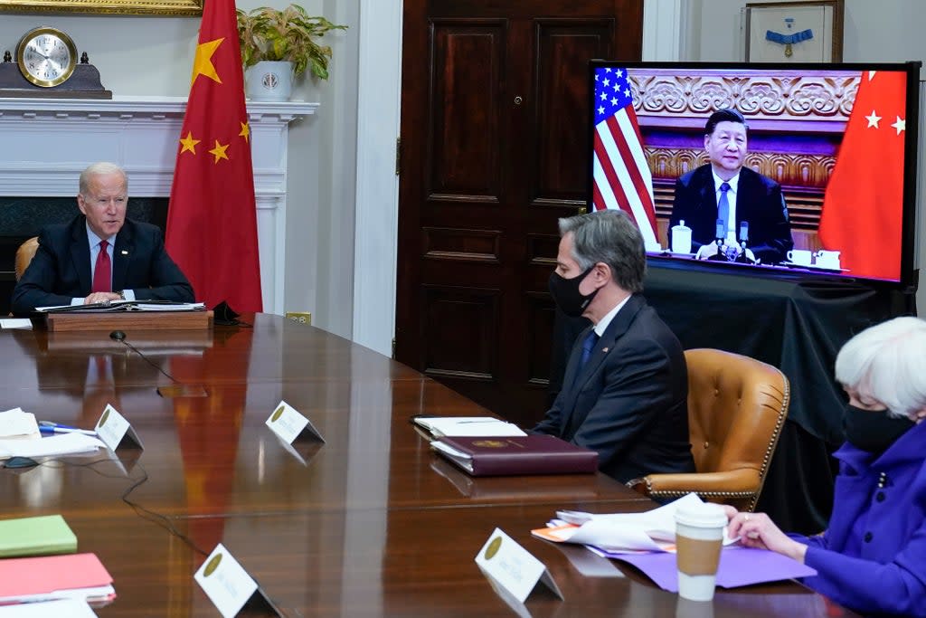 President Joe Biden meets virtually with Chinese president Xi Jinping from the Roosevelt Room of the White House in Washington on Monday (AP)