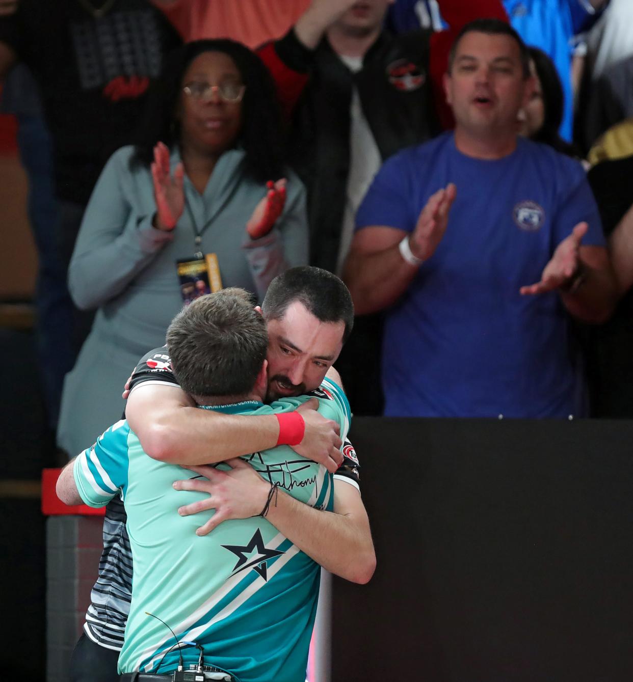 Marshall Kent, facing, hugs Anthony Simonsen after beating him to win the 2024 PBA Tournament of Champions at AMF Riviera Lanes Sunday in Fairlawn