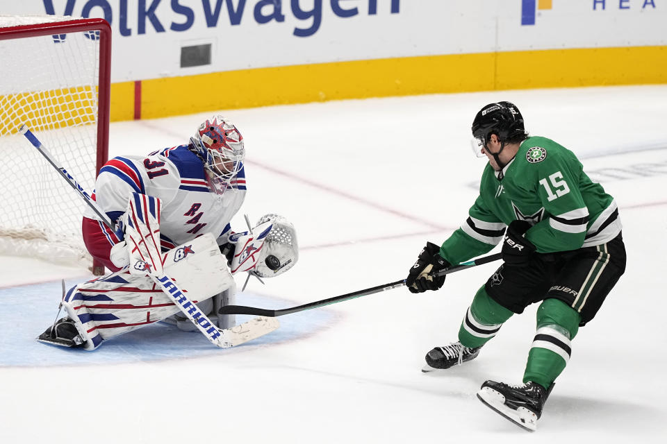 New York Rangers goaltender Igor Shesterkin (31) gloves a shot from Dallas Stars center Craig Smith (15) in the third period of an NHL hockey game in Dallas, Monday, Nov. 20, 2023. (AP Photo/Tony Gutierrez)