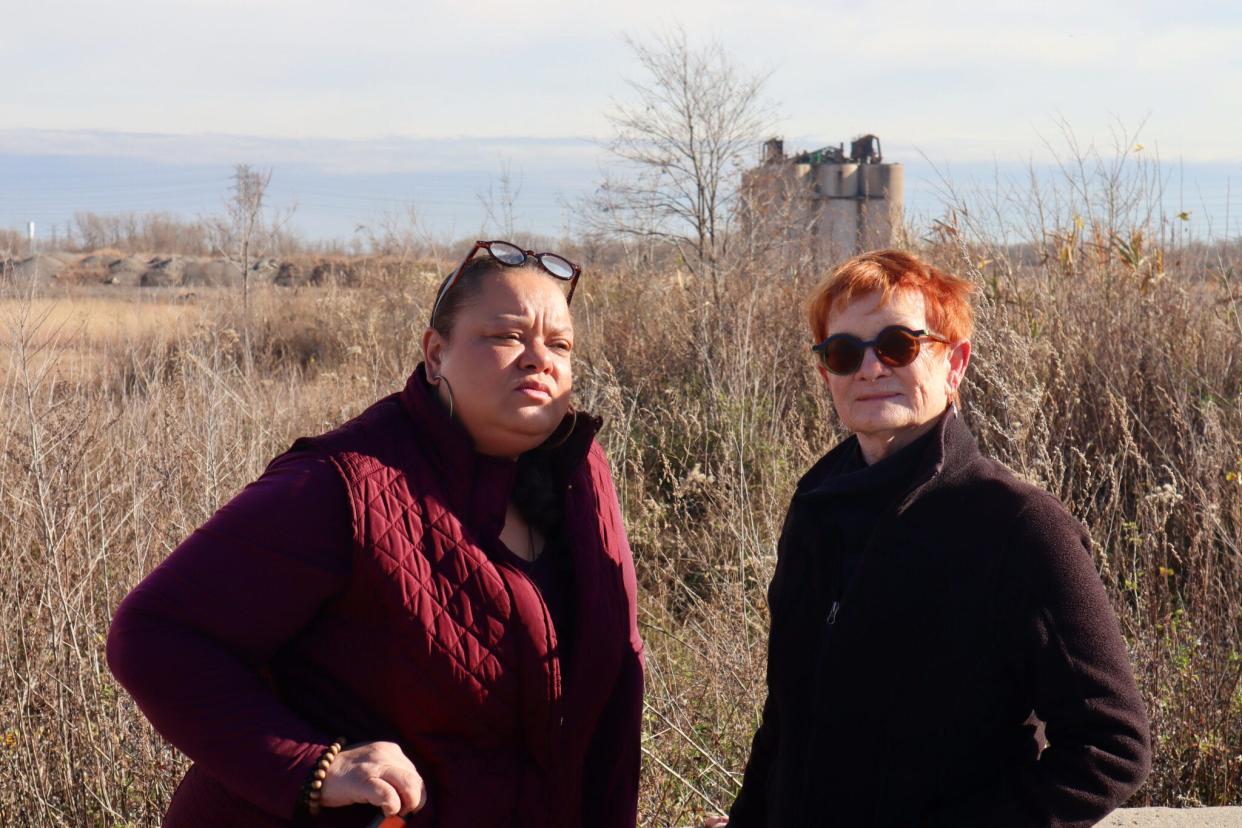 Kimmie Gordon and Dorreen Carey stand in front of a former cement plant site in Gary, Indiana, where a California company, Fulcrum BioEnergy, wants to turn trash and plastic into jet fuel. They are founding members of Gary Advocates for Responsible Development.