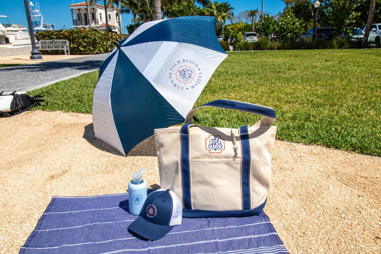 A tote bag, umbrella, hat and water bottle featuring the Town of Palm Beach Marina's nautical-inspired logo are among the featured items in a new line of branded apparel and accessories.
