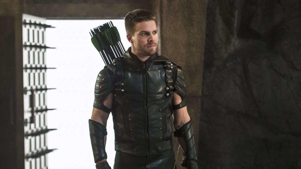 Stephen Amell as Oliver Queen suited up as Green Arrow
