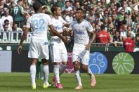 Schalke 04's players Joel Matip (L), Roman Neustaedter and Eric-Maxim Choupo-Moting (R) celebrate after Werder Bremen scored an own goal during the German Bundesliga first division soccer match in Bremen, Germany August 15, 2015. REUTERS/Fabian Bimmer