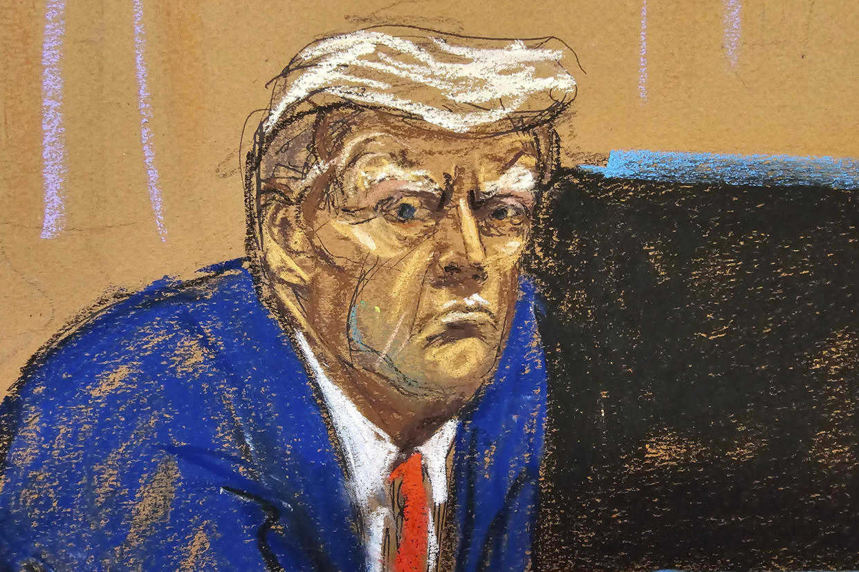 Former President Donald Trump turns to face the audience at the beginning of his trial.