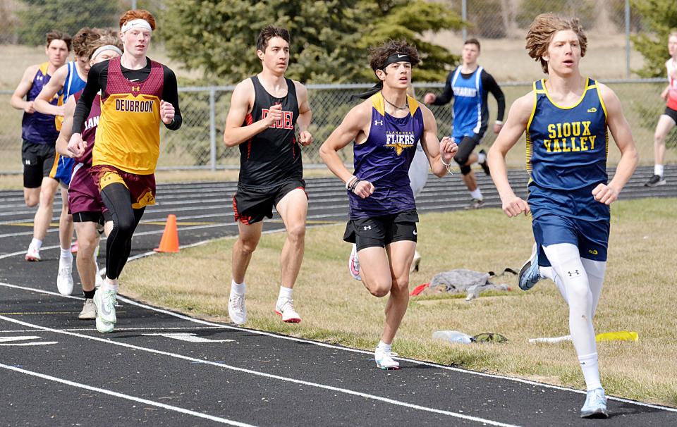 Sioux Valley's Skylar Trygstad leads Brenton Westberry of Flandreau, Ricky Berndt of Deuel and Landen Johnson of Deubrook Area during the Pat Gilligan Alumni track and field meet on Tuesday, April 25, 2023 in Estelline.