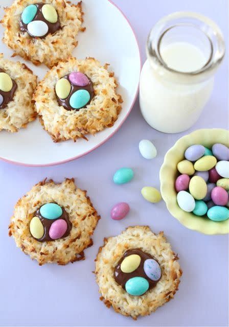 coconut macaroons with an indention in the center filled with nutella and mini egg candies