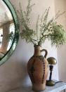 <p>"This is a 1960s Heals convex mirror and I bought the vase for five euros from a man selling them on the side of the road in Italy."</p>