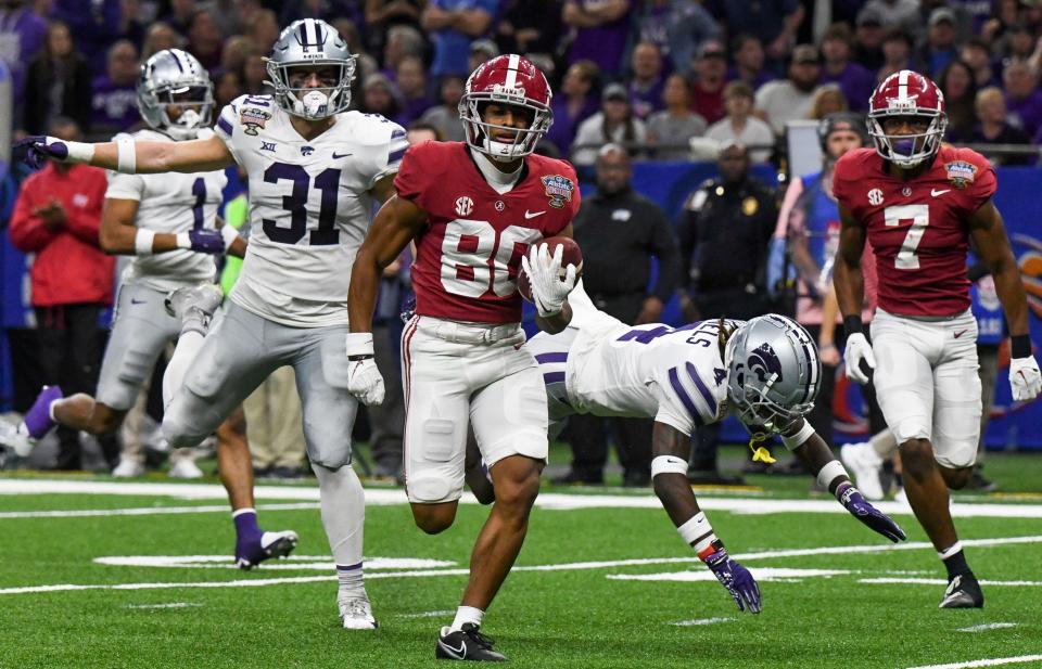 Alabama wide receiver Kobe Prentice (80) sprints away from Kansas State defensive back Jake Clifton (31) before scoring a touchdown during the 2022 Sugar Bowl at Caesars Superdome.