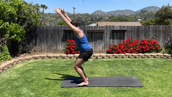 Man on a yoga mat in his backyard practicing yoga for tall peopleee